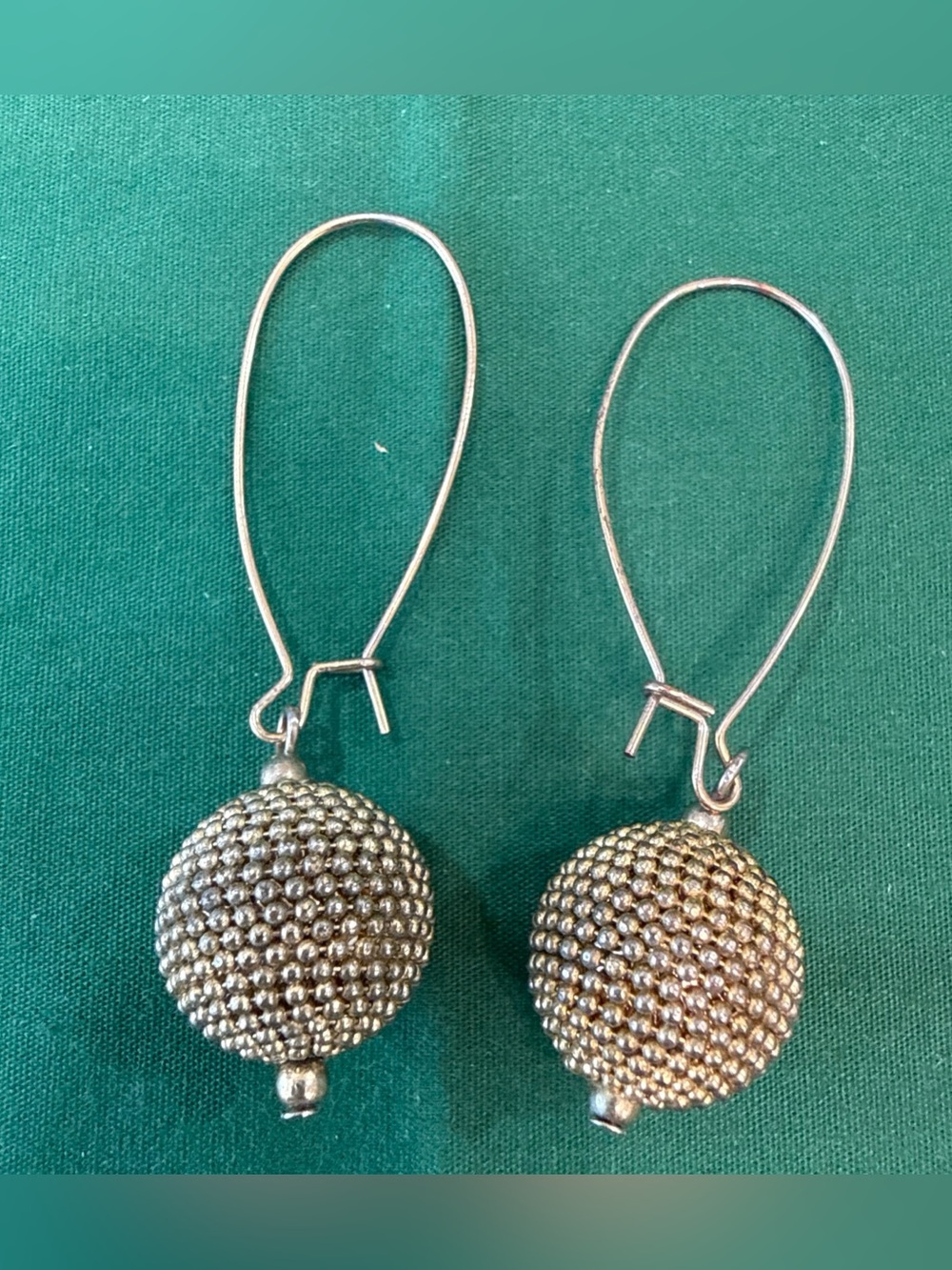 Goldtone Textured Ball Drop Earrings Suspended By Wire Hooks. 17E